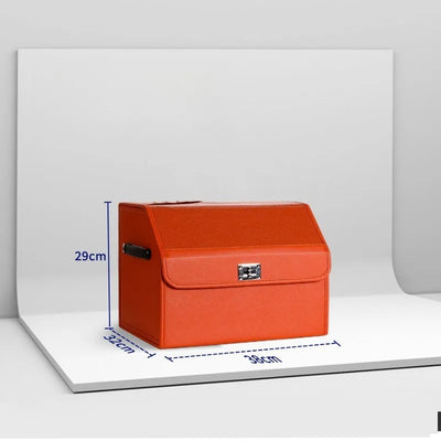 An orange faux-leather storage box with a hinged front flap and silver metal latch, shown on a white display board with blue dimension lines indicating 29cm height, 32cm width, and 39cm depth.