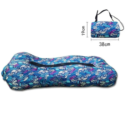 Floral-patterned travel pillow with dimensions on a white background