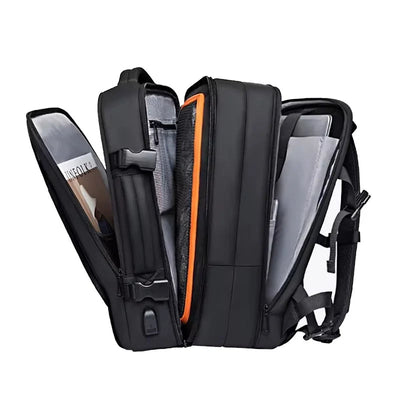 Black backpack with compartments and a visible brand name on a white background