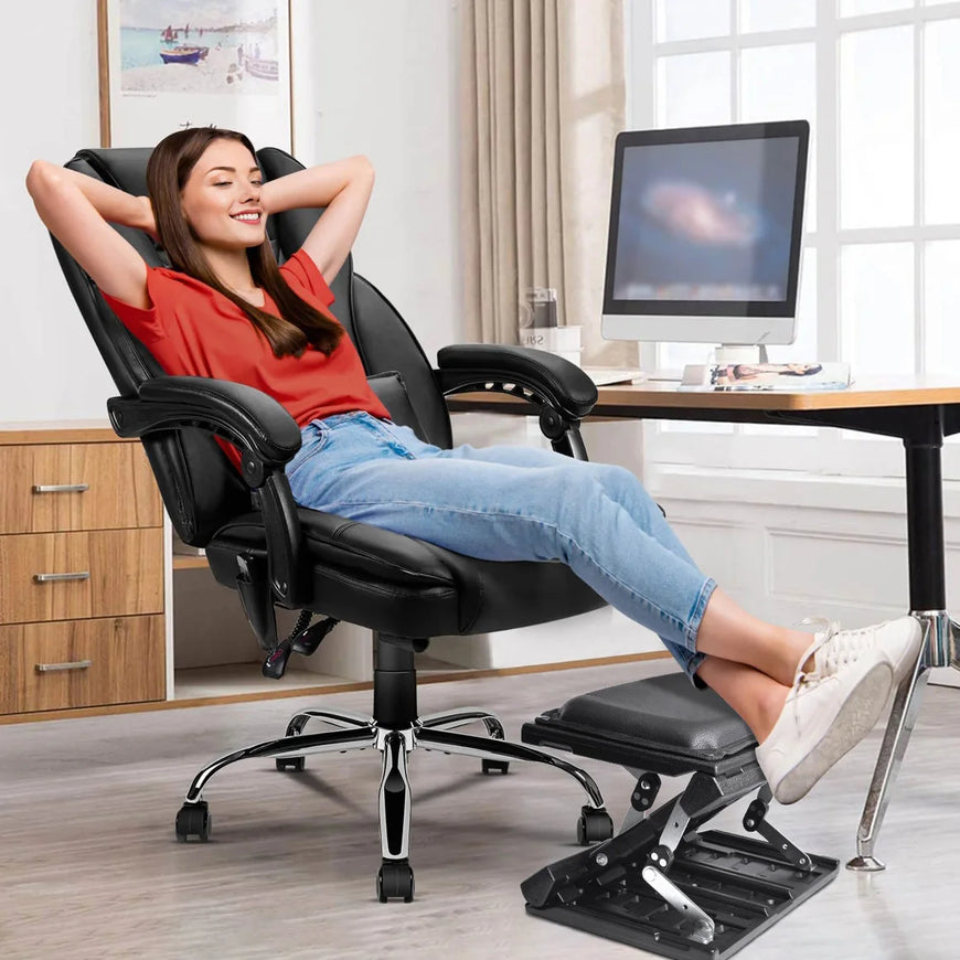 Woman relaxing on a black office chair with footrest in a home office setting.