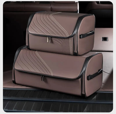 Two brown car trunk organizer bags with black trim stacked inside a car trunk.