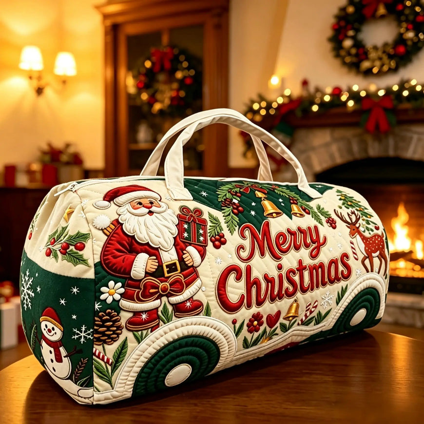 A cylindrical Christmas-themed storage bag or duffel bag with embroidered holiday motifs, including Santa Claus, a snowman, pinecones, holly, bells, and large red 'Merry Christmas' lettering, placed on a wooden table in a warmly lit Christmas room.