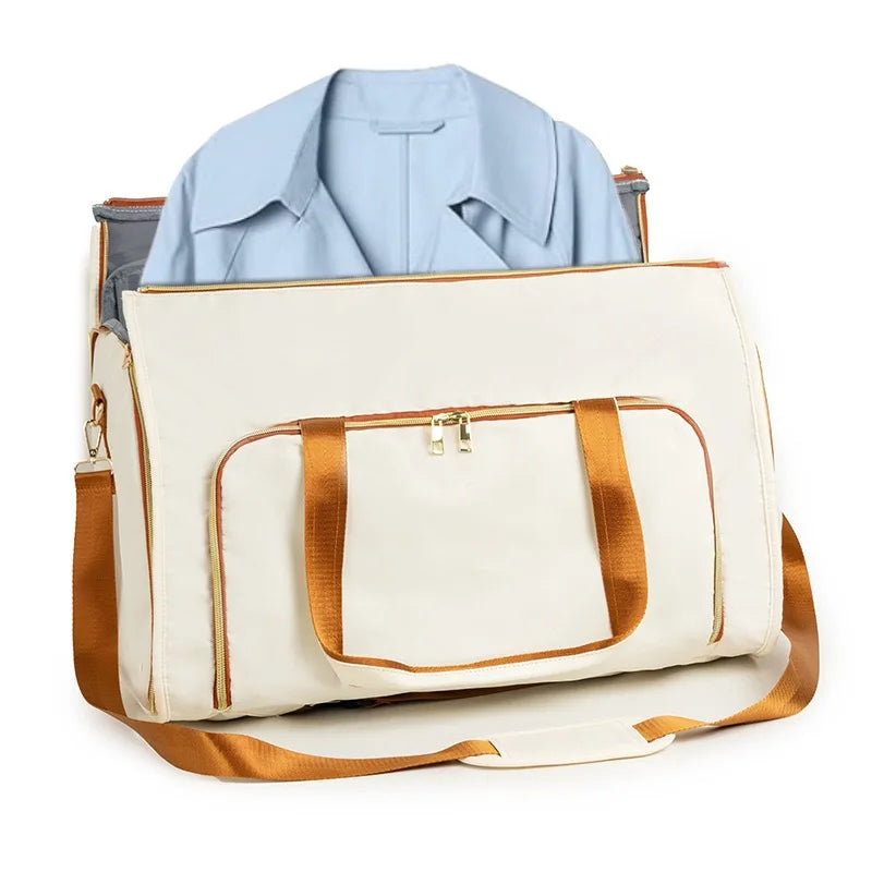White duffel bag with brown straps containing a light blue shirt on a white background