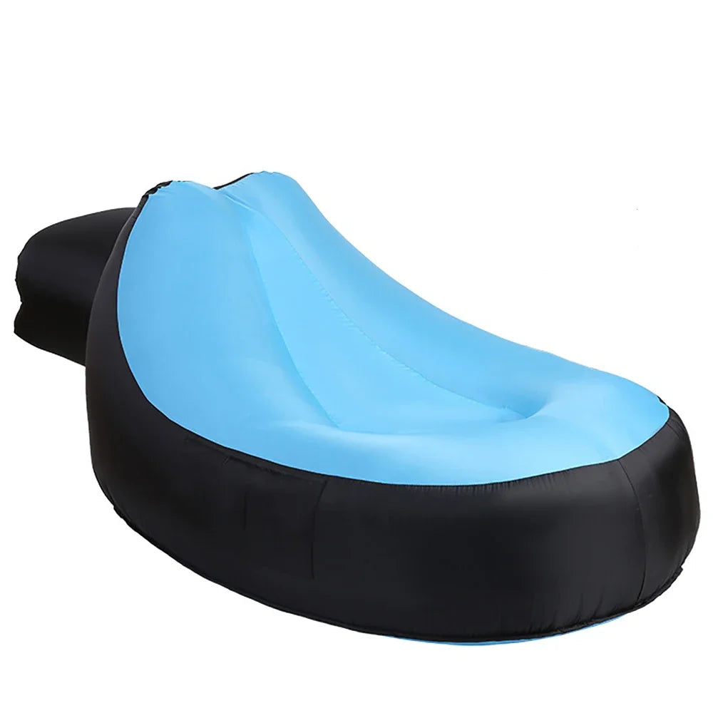 Inflatable chair with blue interior and black exterior, including a matching carrying bag, on a white background.