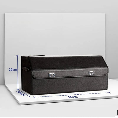 A dark gray fabric storage box with silver metal clasps, shown on a white display board with blue dimension lines indicating measurements of 56cm length, 32cm width, and 29cm height.