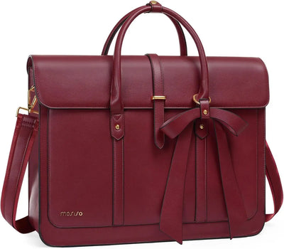 Red leather bag with a bow on a white background