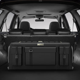 Black cargo organizer in the back of a vehicle with 'S&R' branding.
