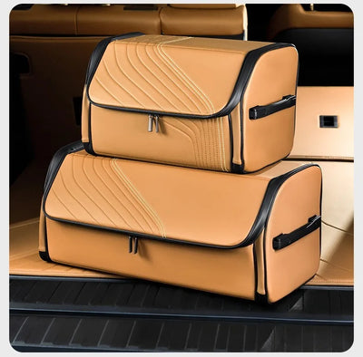 Two tan car trunk organizer bags with black trim, stacked inside a car trunk.