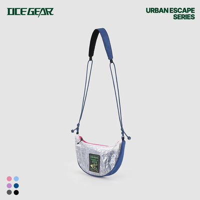 Clear crossbody bag with blue straps and a visible brand logo on a light gray background