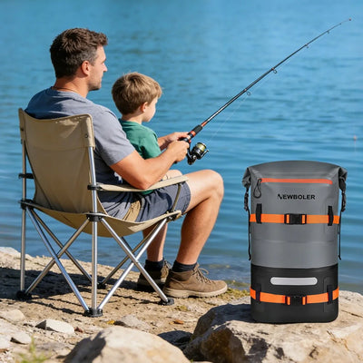 Man and child fishing by a lake with a Newboler cooler bag nearby.