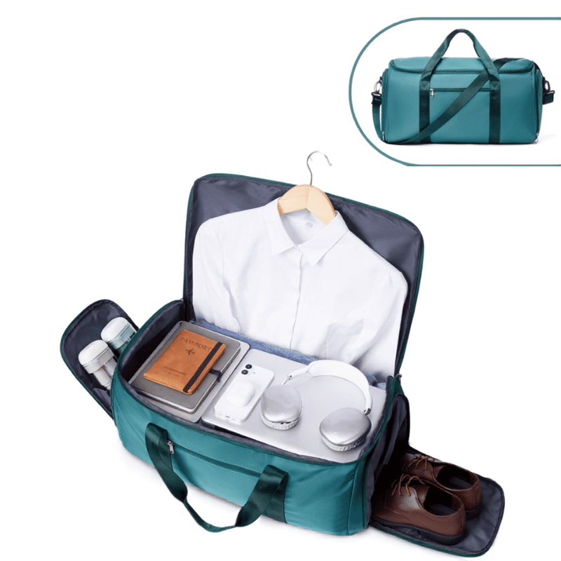 A teal and dark gray carry-on luggage bag shown open, filled with a white shirt, notebook, phone, headphones, toiletries, and brown shoes. A smaller inset at the top right shows the closed bag with handles and shoulder strap.