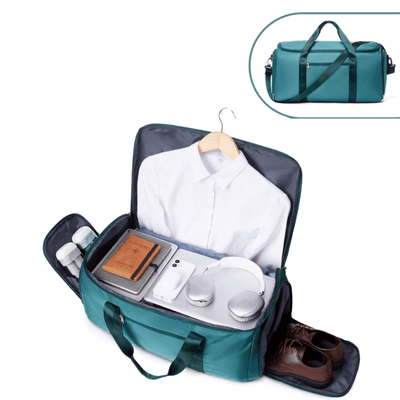 A teal and dark gray carry-on luggage bag shown open, filled with a white shirt, notebook, phone, headphones, toiletries, and brown shoes. A smaller inset at the top right shows the closed bag with handles and shoulder strap.