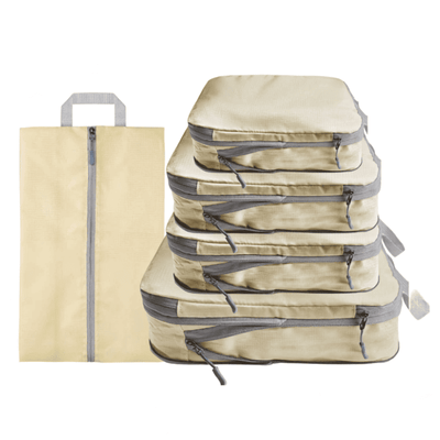 A set of beige packing cubes and a matching zippered sleeve with gray zippers and handles, shown on a plain white background.