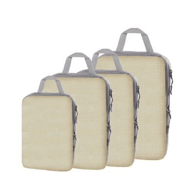 Four beige woven packing cubes with gray handles and zipper trim, arranged in a descending size order on a white background.