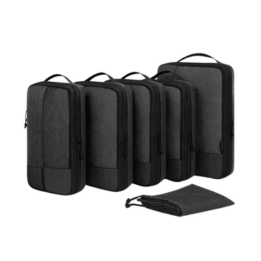 Five dark gray packing cubes of different sizes arranged in a row, with a matching dark gray drawstring pouch placed in front, on a plain white background.