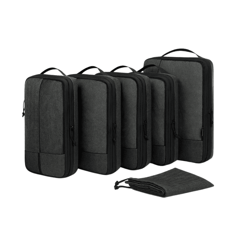 Five gray packing cubes of different sizes arranged in a row, with a matching gray drawstring pouch placed in front, on a clean white background.